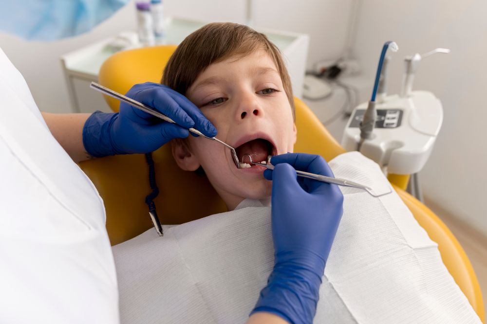 a boy is having dental filling treatment